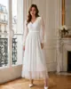 Vestido de malla de punto con cuello en V y manga larga de lunares, estilo francés transfronterizo 2026 para mujer, elegante y favorecedor, de longitud media con falda fluida