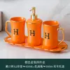 Juego de baño cerámico juego de lavado cinco piezas botella de loción de cerámica decoración de inodoro hotel hogar venta al por mayor transfronteriza