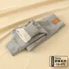 Joelheiras de camada dupla calças quentes infantis espessadas uniforme escolar de aluno do ensino fundamental essencial outono e inverno meninos e meninas camada base de uso interno classe A calças