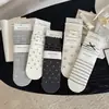 Nuevo estilo de otoño e invierno: Calcetines japoneses simples y versátiles de gato lindo hasta la mitad de la pantorrilla con lazo, calcetines de moda para mujer, suaves y cómodos