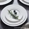 Platos Redondos Blancos Puros Estilo Occidental de Cerámica para Hotel Platos Comerciales Platos para Bistec Platos de Hueso Platos Planos Platos Hondos Venta al por Mayor para Exportación