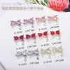 Celebridad de Internet Nueva Joyería para Uñas Corazón Cristal Diamante Super Brillante Circonita Colgante de Lazo Luz de Estrella Metal Joyería de Diamantes para Uñas