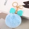 Suministro al por mayor de fábrica de llavero con bola de pelo de conejo Rex de imitación de 8 cm, colgante creativo para bolsa de regalo.