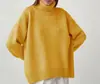 Suéter de cuello alto de color liso transfronterizo europeo y americano para mujer, otoño e invierno 2026, tejido clásico suelto y versátil de la fábrica de origen