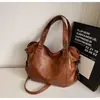 Bolsa de mano vintage transfronteriza para mujer, nueva moda primavera 2026, moderna, simple, bolso cruzado único, bolso de hombro para el trabajo