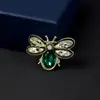 Versión coreana de broche de perla de diamante de alta calidad, moda, hebilla de mariposa anti-luz para bufanda, pasador fino de alta calidad, venta al por mayor de ropa