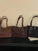 Bolsa de mano minimalista transfronteriza, nuevo estilo 2026, gran capacidad, bolso de hombro moderno, texturizado, casual y adecuado para el trabajo, se puede llevar debajo del brazo