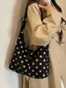 Bolsa casual de lunares de alta calidad para mujer 2026 nueva bolsa de mano de gran capacidad versátil para ir al trabajo bolsa de un solo hombro para el antebrazo