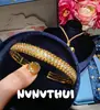 Collar Colgante Bolsa de la Suerte Tradicional con Lazo de Pedrería Chapado en Oro Acabado Cepillado, Nuevo Estilo Chino Colgante Largo de Ojo de Tigre Calabaza Ojo de Gato