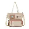 Bolsa de ombro para estudante do ensino fundamental, unissex, casual, grande capacidade, adequada para a escola e aulas de reforço, bolsa transversal, bolsa tote de lona versátil