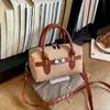 Bolso de Hombro de Diseño de Nicho Simple de Moda para Mujer 2026 Nuevo Bolso de Mano con Bloques de Color Bolso Cruzado Redondo Cilíndrico para el Trabajo