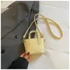 Mini bolso cubeta tejido brillante estilo coreano con colgante de poni, bolso de mano para el trabajo y los desplazamientos, bolso cruzado para mujer