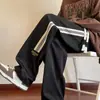 Pantalones casuales de otoño para hombre, recién llegados, estilo Hong Kong, modernos, holgados, de talla grande, con pierna recta, pantalones anchos a rayas a la moda para estudiantes.
