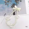 Cordón para teléfono móvil con forma de corazón y lazo de perla para niña, cadena de cuentas hecha a mano, colgante corto en forma de U para mujer