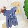 Ropa para niños, verano 2022, nuevo vestido de niña con lazo enrejado, sin espalda, manga voladora, falda de princesa de algodón, estilo europeo y americano.