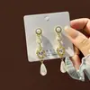 Brincos de Pérola Coreanos de Alta Qualidade 2026, Agulha de Prata Estilo Vintage Chanel Diamante Colorido Estrela de Oito Pontas Brincos de Tarraxa Atacado