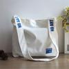 Nova Bolsa de Lona com Estampa de Cabeça de Gesso Japonesa Bolsa Transversal de Lona Moda Coreana Mochila de Ombro para Menina Atacado