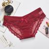 Ropa interior sexy de encaje de comercio exterior Cintura baja Sin costuras Ultradelgada Malla transparente Lazo calzoncillos para damas Suministro directo de fábrica