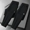 Calças masculinas para primavera e outono, calças casuais da moda com bolsos com zíper, calças esportivas jogger retas largas
