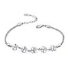 Versión coreana de adornos de mano de alta gama pulsera de hierba de la suerte para mujer pulsera con incrustaciones de cristal San Valentín los más vendidos fabricantes de joyería al por mayor