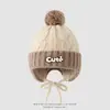 Chapéu infantil de tricô com tranças e blocos de cor estilo coreano, com proteção para as orelhas, chapéu quente de tricô com pompom para outono e inverno, para meninos e meninas