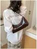 Bolso de axila de diseño de nicho versátil de alta gama, nuevo modelo transfronterizo, bolso de hombro casual vintage simple, bolso para el trabajo