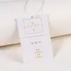Etiquetas de ropa impresas con lámina de oro hechas a medida, etiquetas de papel engrosado para prendas, impresión de logotipos, etiquetas para ropa de niños y tarjetas de etiquetas personalizadas