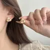 Brincos de Nó Concêntrico Escovado Estilo Hong Kong Agulha de Prata para Mulheres, Design Único de Alto Padrão, Estilo Minimalista de Nicho