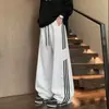 Pantalones de chándal resistentes estilo americano para hombre, pantalones de tres rayas para primavera y otoño, pantalones deportivos casuales rectos holgados versátiles para adolescentes y estudiantes