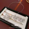 Juego de Joyería de Flor Hueca Aretes de Circonita con Aguja de Plata Cadena para Clavícula Moda Sencilla Joyería de Temperamento de Alta Gama al Por Mayor