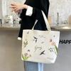 Bolsa de Lona Feminina Original 2025 Nova Bolsa de Mão Estudante Casual Bolsa de Ombro Bolsa de Nicho Dropshipping Atacado