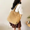 2025 Nova Bolsa de Lona Feminina Exquisita Grande Capacidade Moda Mais Fácil de Combinar Portátil Estudante Ombro Bolsa Tote de Moda