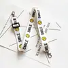 Nuevos Accesorios de Lanyard para Teléfono Móvil de Cinta Accesorios Multiusos Cruzados Resistentes a Caídas Bolsa con Lanyard de Carita Sonriente Accesorios para Bolsa de Videocámara