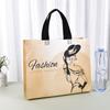 Bolsa de tela no tejida con logotipo personalizado para tienda de ropa, bolsa de regalo publicitaria, bolsa de compras con película, venta al por mayor