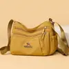 Bolso de mujer nuevo simple versátil bandolera gran capacidad multi-compartimento bolso cruzado moda retro bolso de mamá mujer