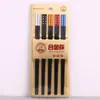 Palillos de aleación de diamante flor de ciruelo empaque blíster palillos familiares cabeza dorada de aleación palillos antibacterianos resistentes a altas temperaturas suministro