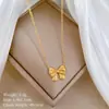 [acero de titanio de cuerpo completo] lazo estilo Mori personalidad minimalista horno collar de oro real femenino ins cadena de clavícula rojo neto