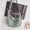 Nova bolsa de ombro e transversal feminina versátil e simples para uso diário, estilo coreano, cor de doce, padrão waffle, artística, transfronteiriça, para estudantes