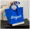 Bolsa de Hombro Estilo Perezoso Coreano al por Mayor para Mujer 2026 Nuevo Bolso Tote con Estampado de Letras Bolso de Tela de Hombro Único de Moda