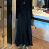 Conjunto de Dos Piezas para Mujer: Top de Punto Adelgazante con Botones y Abertura en la Espalda + Falda de Tiro Alto con Efecto Adelgazante
