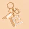 Llavero de Iniciales Accesorios para Mochila de Mujer Hebilla de Langosta Colgante Letras Inglesas Amor Borla Llavero Lindo Colgante