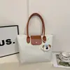 Bolsa de Mão Tendência da Moda deste Ano com Alça Única 2026 Primavera Nova Estilo Coreano Bolsa de Trabalho Feminina Bolsinha Personalizada Ins de Axila