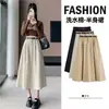 Foto real de falda midi de algodón lavado estilo europeo para mujer de otoño, de cintura alta, con bajo amplio, adecuada para tipo de cuerpo pera, con un efecto de caída que disimula las caderas