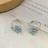 Pendientes de gota de aceite crema flor de cinco pétalos hueca estilo ins frescos y dulces color flor dopamina joyería de oreja nicho