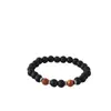 Accesorios de explosiones transfronterizas piedra volcánica negra mate de 8 mm piedra de ámbar fósil de viento pulseras de yoga para hombres y mujeres al por mayor