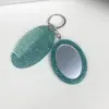 Nuevo Espejo Ovalado Espejo Multifuncional Peine Llavero Moda Versátil Colgante para Bolso/Llave Herramienta de Maquillaje Portátil