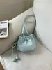 Bolso de cubo con cordón de diseño de nicho elegante transfronterizo para mujer, nueva versión coreana, bolsa de la suerte de nicho, bolso de hombro único cruzado de moda