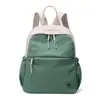 Mochila pequena para estudante 2026 outono nova urbana minimalista bolsa de tecido de nylon transfronteiriça moderna leve mochila de viagem