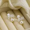 Pendientes de Temperamento Exquisito de Nicho con Perlas de Swarovski y Lazos Franceses Pinzas para Orejas en Forma de Bobina de Mosquitos para Mujeres Sin Perforaciones Pendientes