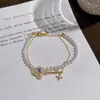 Pulsera de Perlas de Doble Capa Llave Mágica Nuevo Estilo de Primavera Lujo Ligero Gama Alta Versátil Accesorio para la Mano Pulsera Exquisita y Elegante
